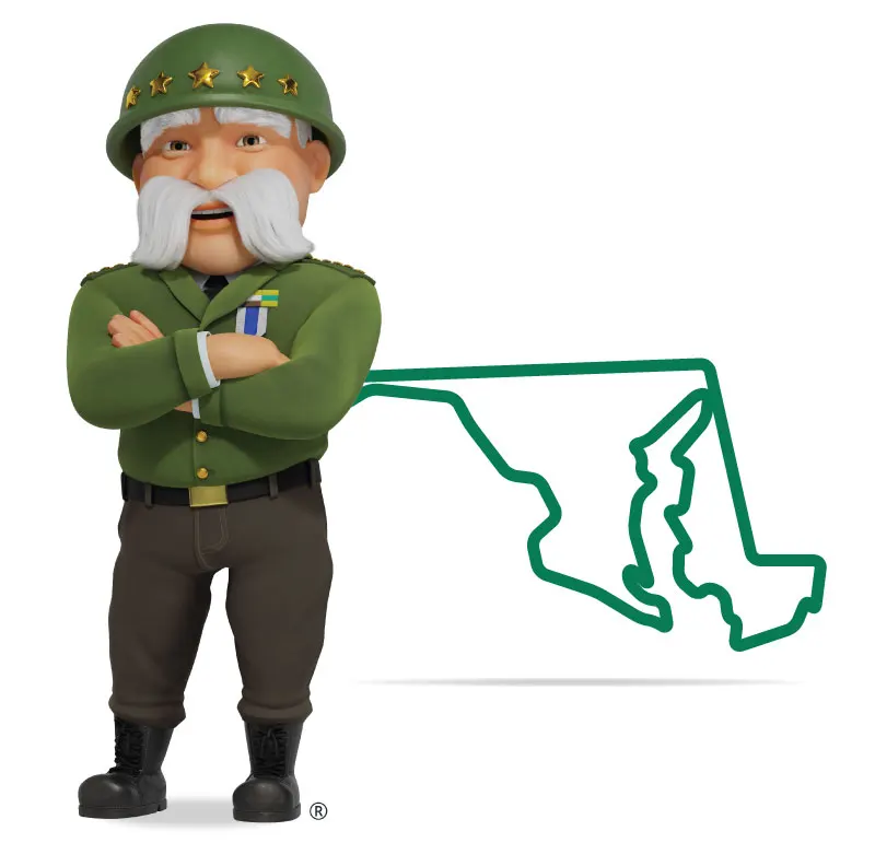 The General standing in front of Maryland with his arms crossed and a smile.
