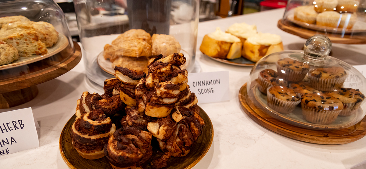 carousel-amenities-cafe-3-bakery-1200x556 Scones, muffins, and other bakery items available at the Library Cafe.