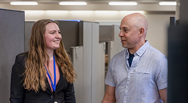 An intern and a Sentry associate having a conversation.