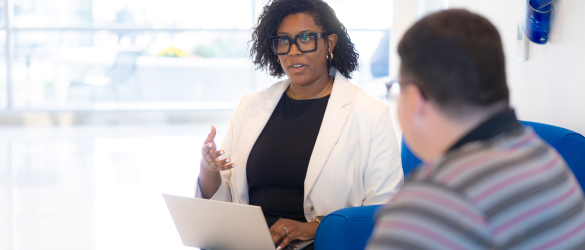 Two business leaders talking in office.