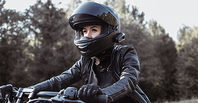 Young woman riding on a motorcycle
