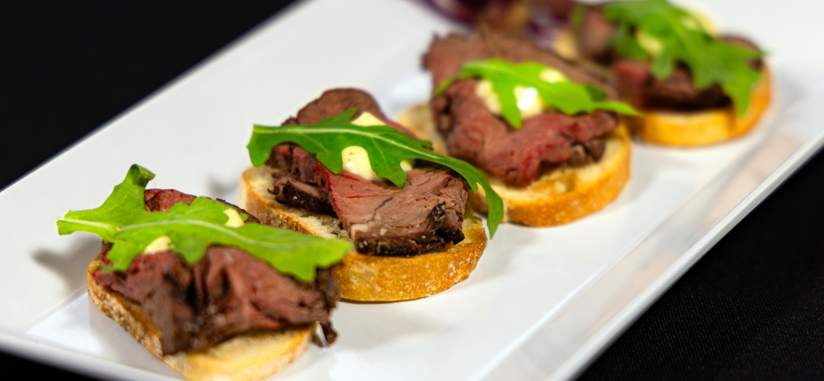 carousel-meeting-services-food-1200x556-03 Steak crostini event menu item at SentryWorld.