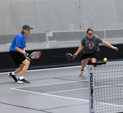 Two pickleball players at SentryWorld.