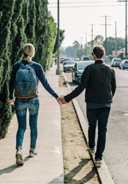 Couple walking and holding hands
