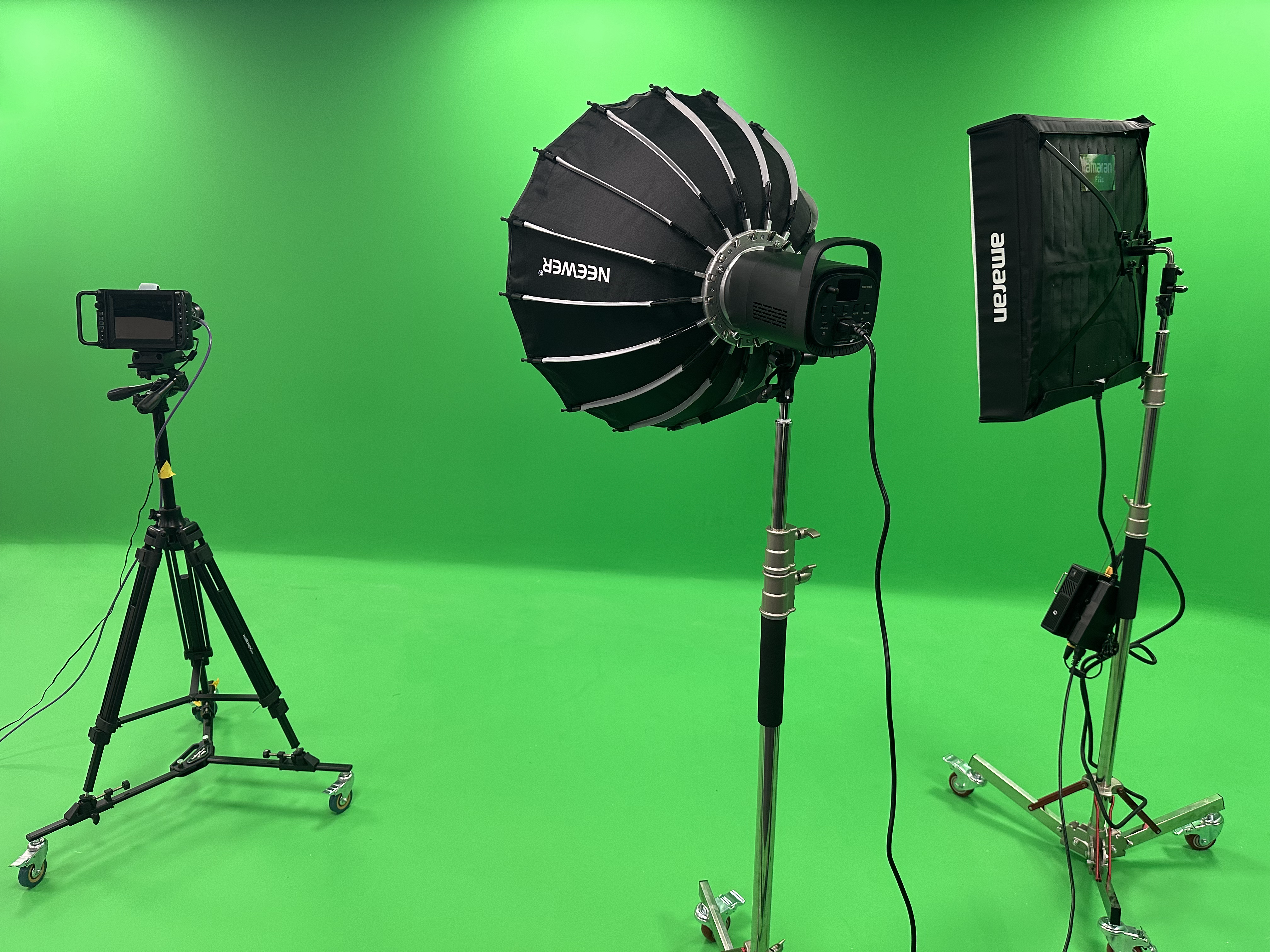 Green-screen media studio with lighting rigs