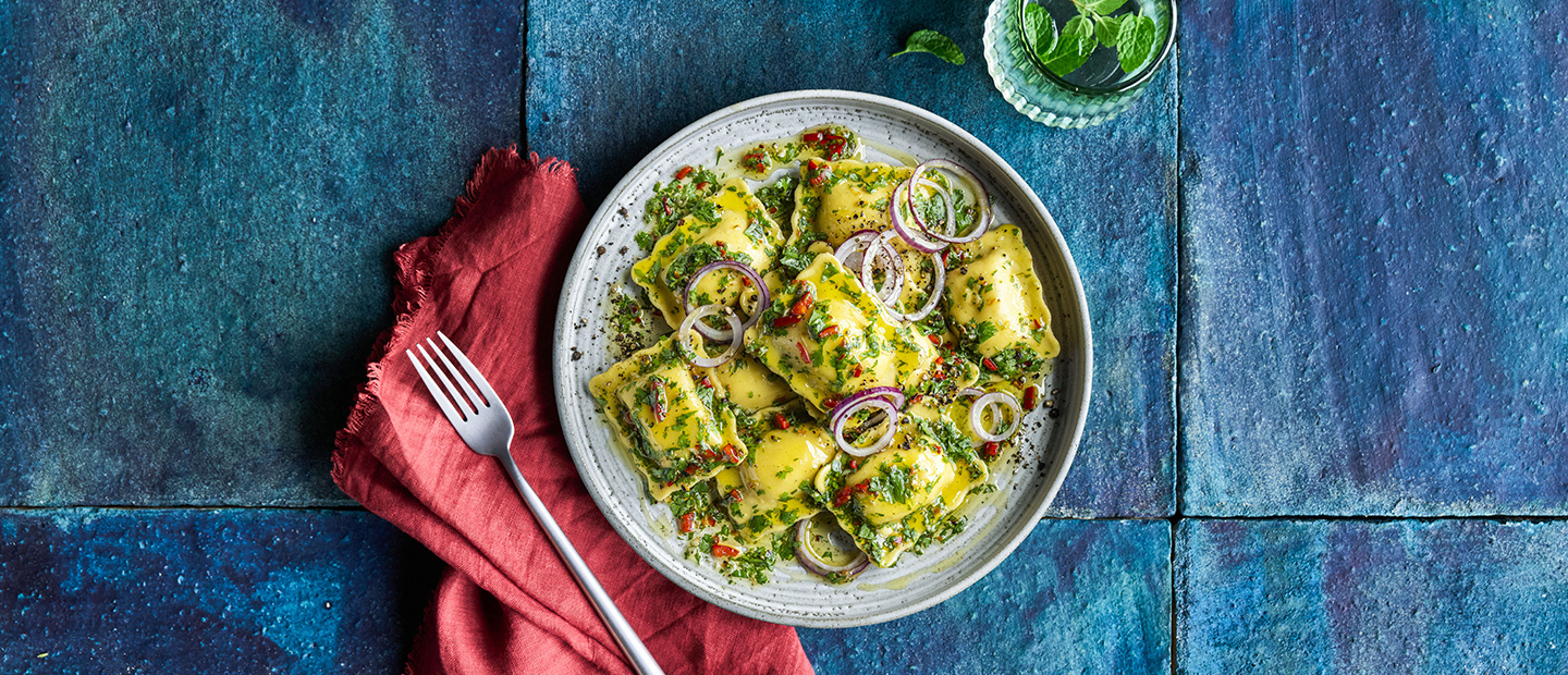 BEEF SHORT RIB RAVIOLI, CHIMICHURRI SAUCE AND SLICED RED ONIONS