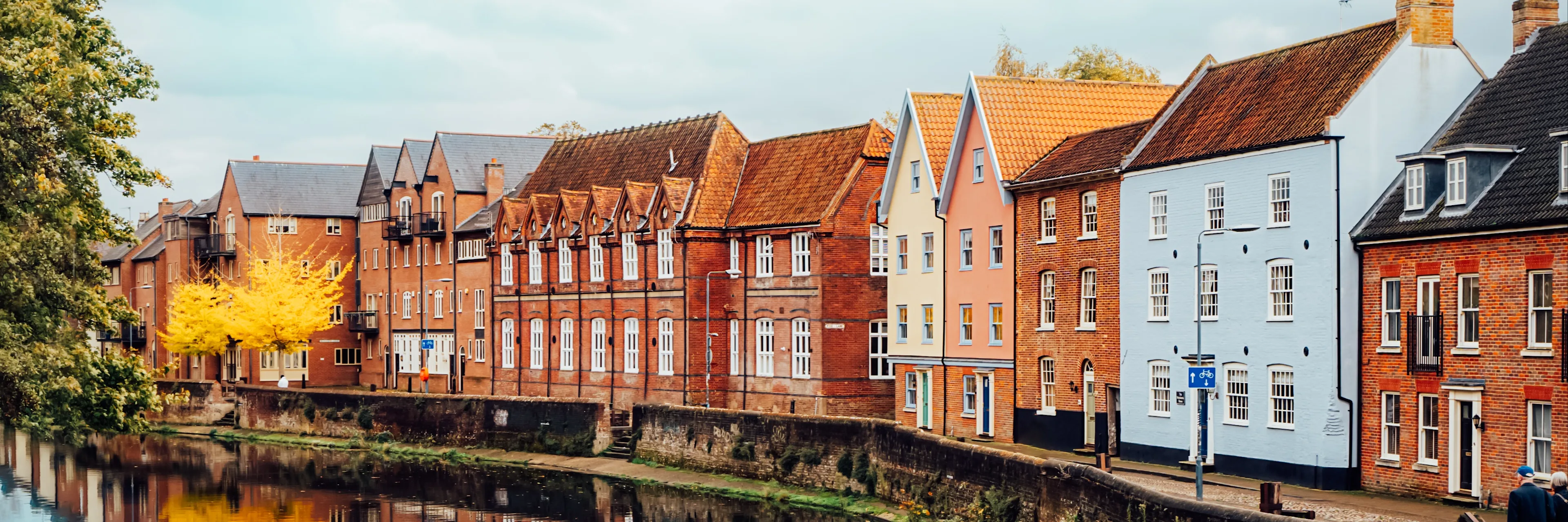 Row of houses by water.