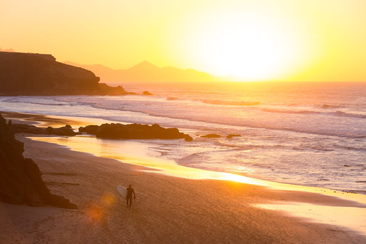 hero surfer in sunset in fuerteventura