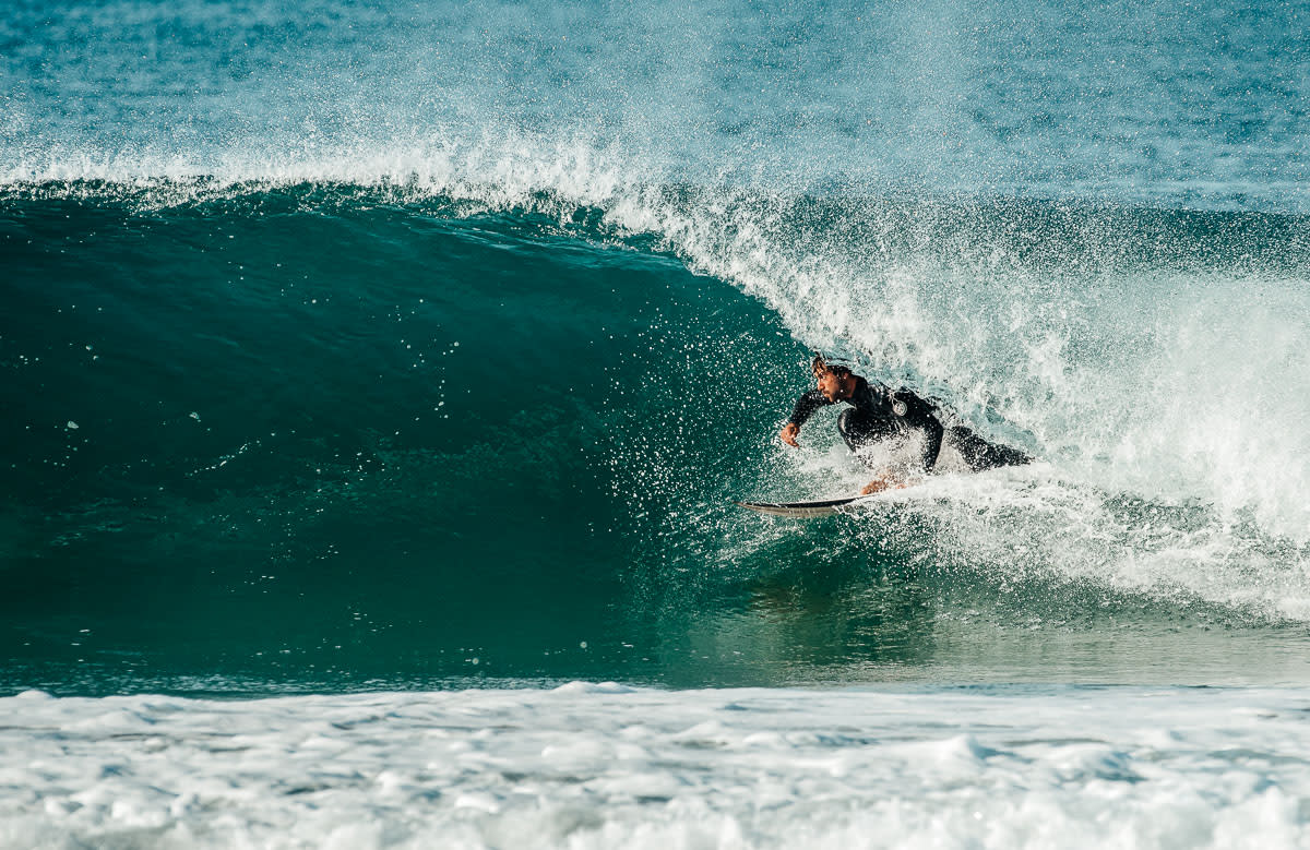 surfer on wave barrell