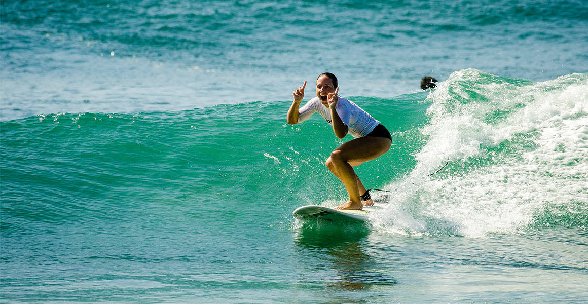 happy surfer green wave