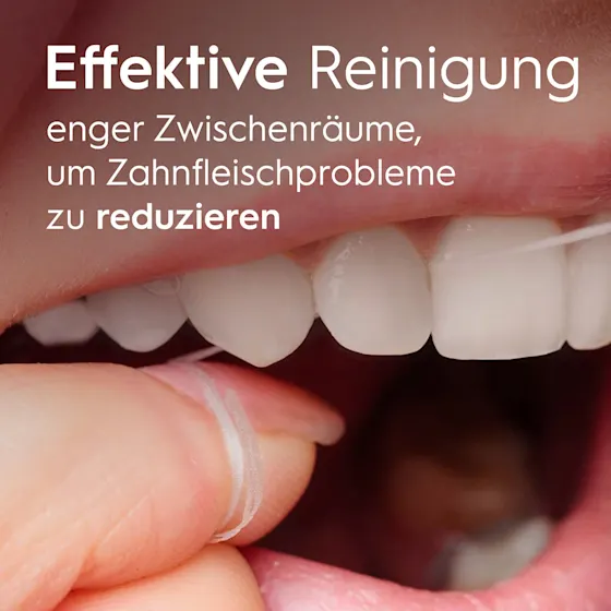 Oral-B Essential Zahnseide Verpackung, die den Hinweis "Entfernt Plaque an Stellen, die eine Zahnbürste nicht erreicht" hervorhebt.