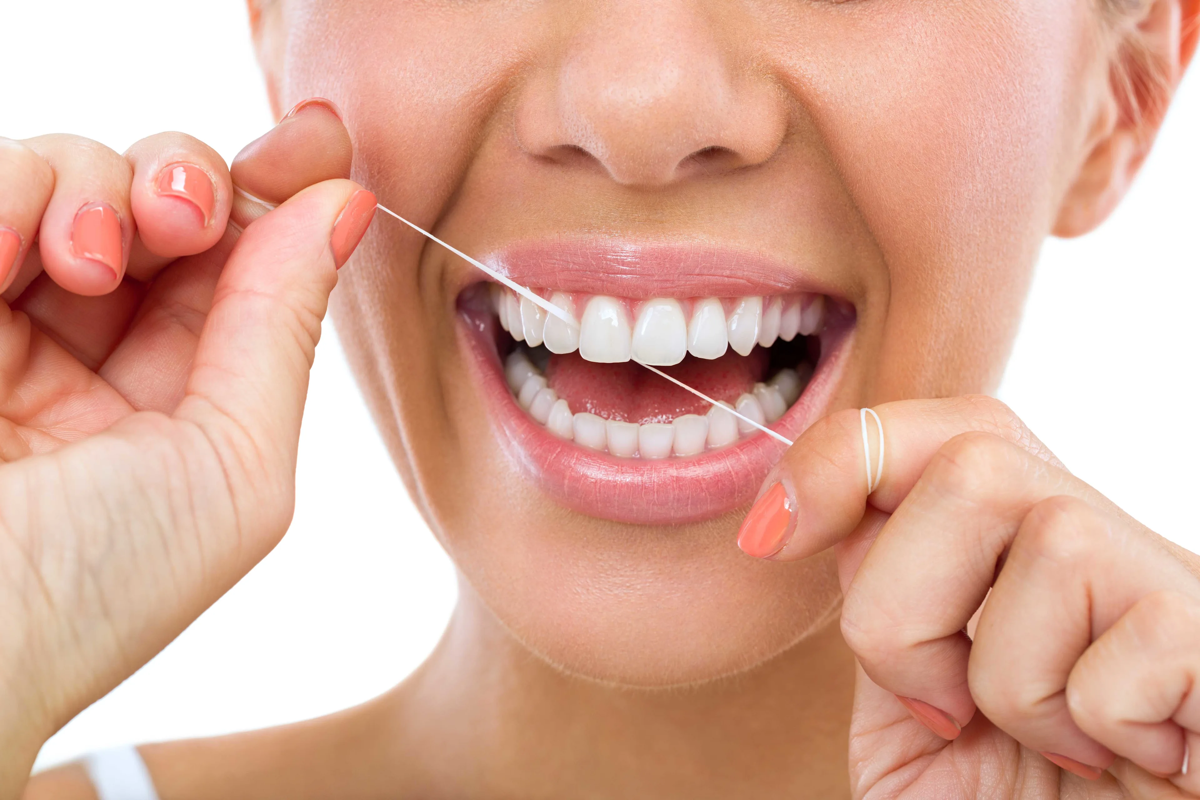 Woman flossing her teeth 