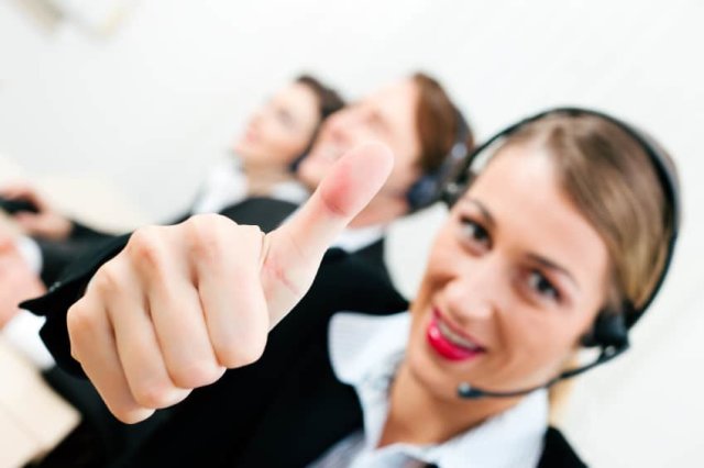 Call center agent giving thumbs up