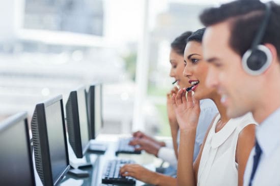 Call center agents in call center busily working