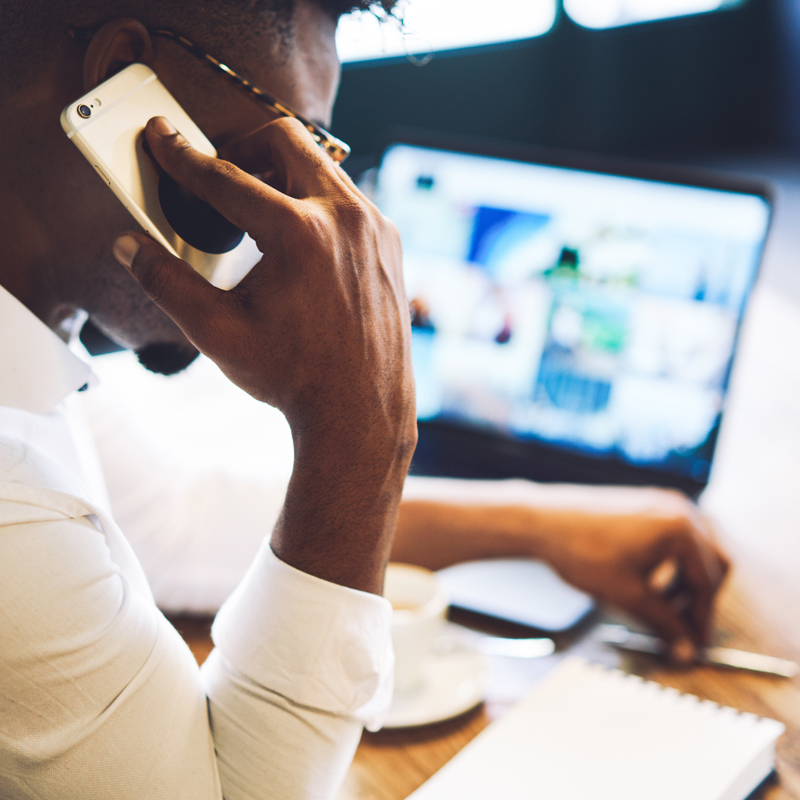 Man on phone at desk
