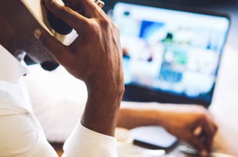 Man on phone at desk