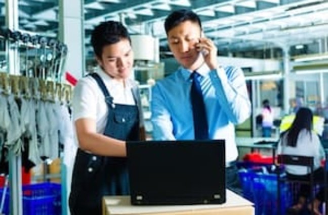 customer service and workers in a factory
