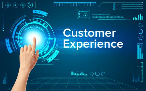 Finger pointing to a screen with the text "Customer Experience"