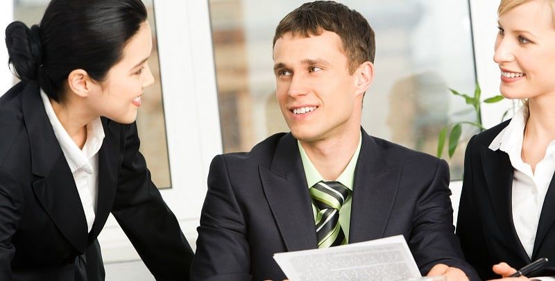 Portrait of business people discussing business-plan in the office