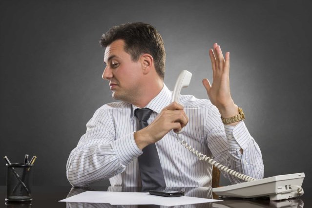 businessman avoiding answering phone