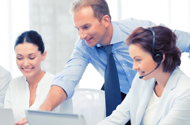 Call center manager giving feedback to agents