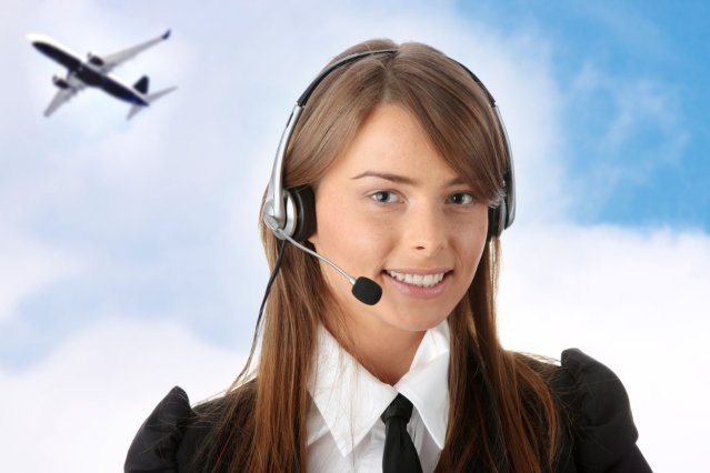 Smiling call center agent with clouds and airplane in background