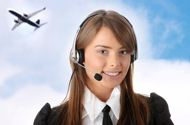 Smiling call center agent with clouds and airplane in background