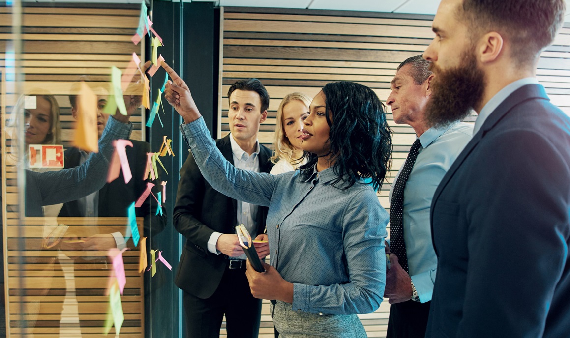man at desk on phone