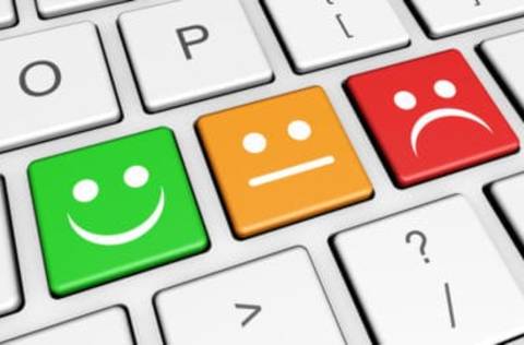 3 keys on a keyboard, happy face, neutral face and sad face