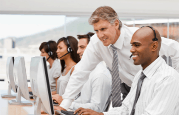 Call center manager coaching an agent