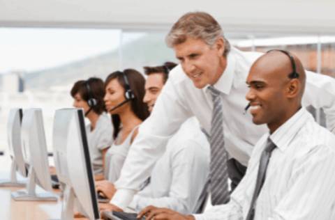 Call center manager coaching an agent
