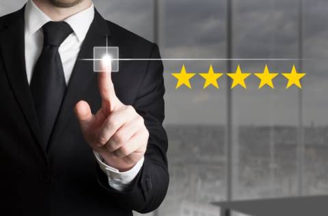 Customer Experience - businessman virtually rating 5 gold stars