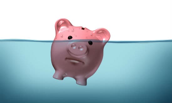 Piggy bank sinking into water