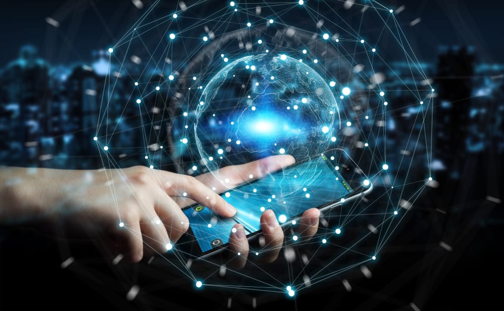 Hand on phone with AI features