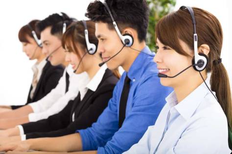 young business people and colleagues working in call center