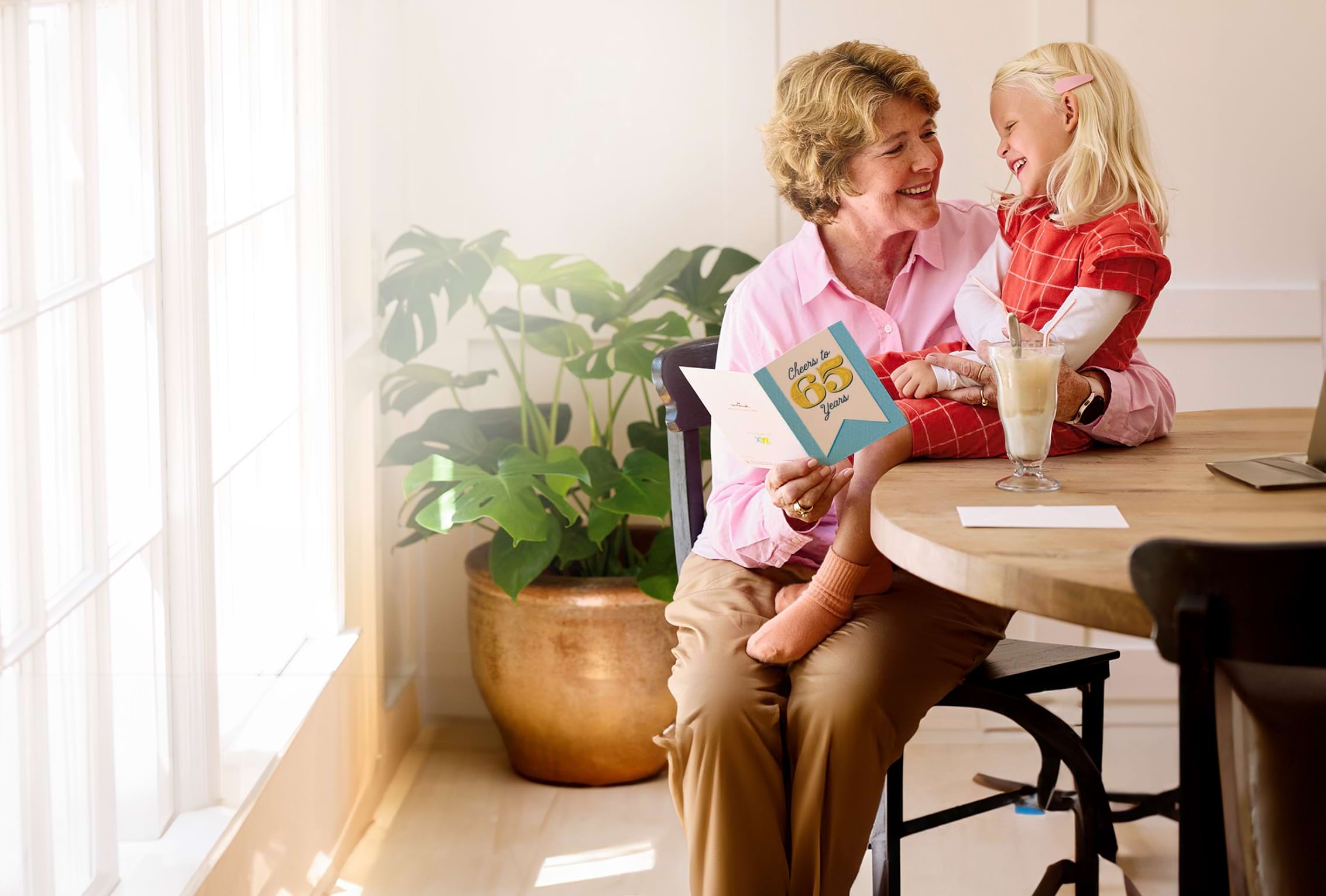 Older Woman with Blonde Girl Reading Card ARTICLE HERO