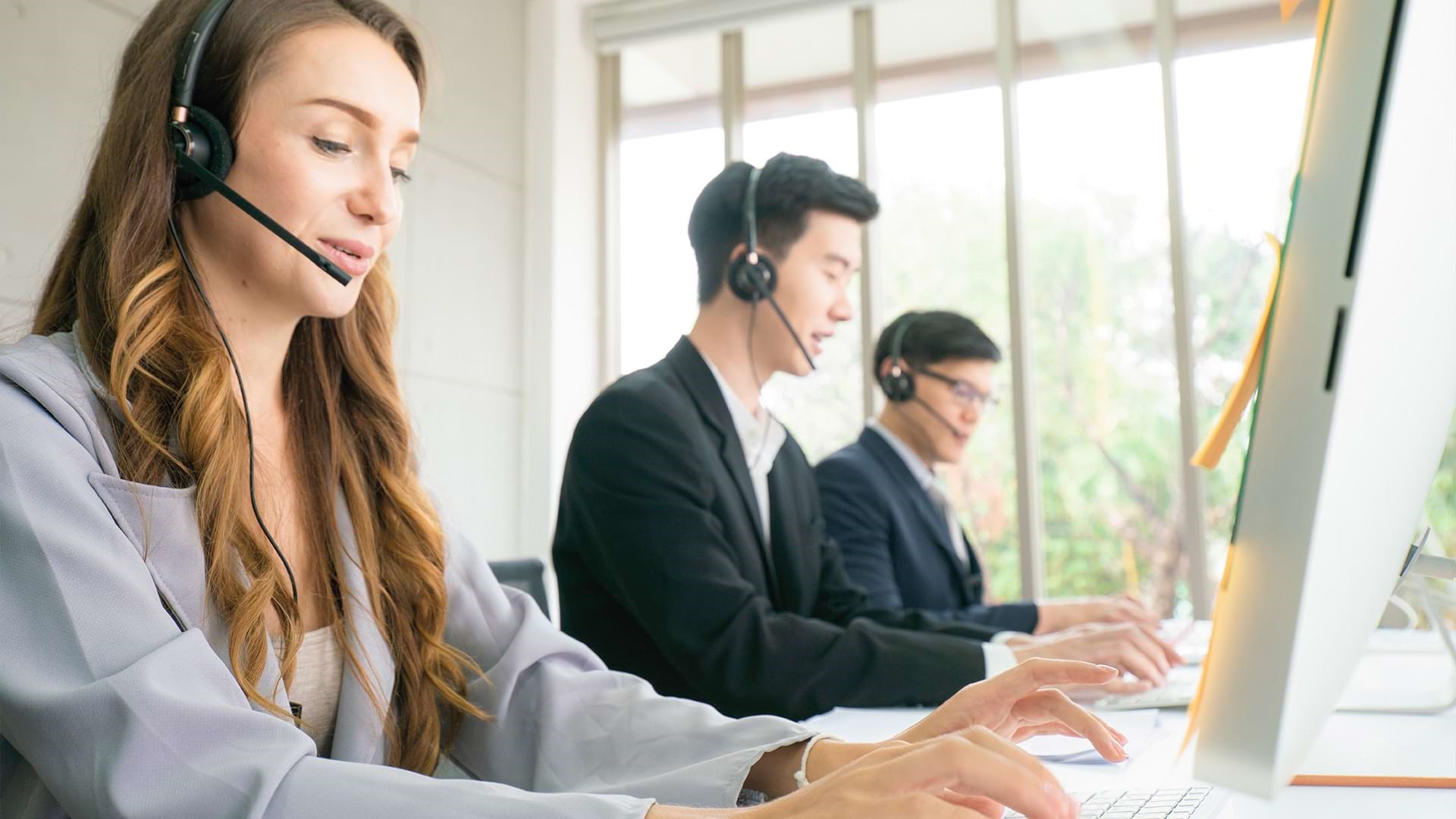 Row of Call Center Representatives SECTION HEADER IMAGE