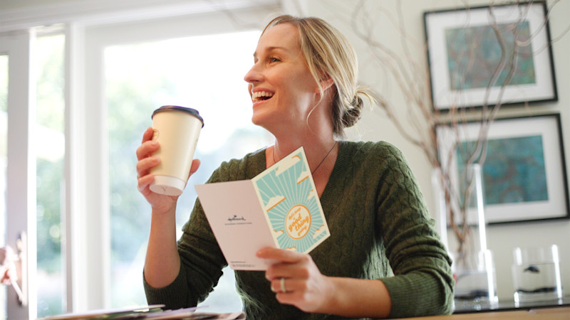 L female reading keep good thing going card drinking coffee