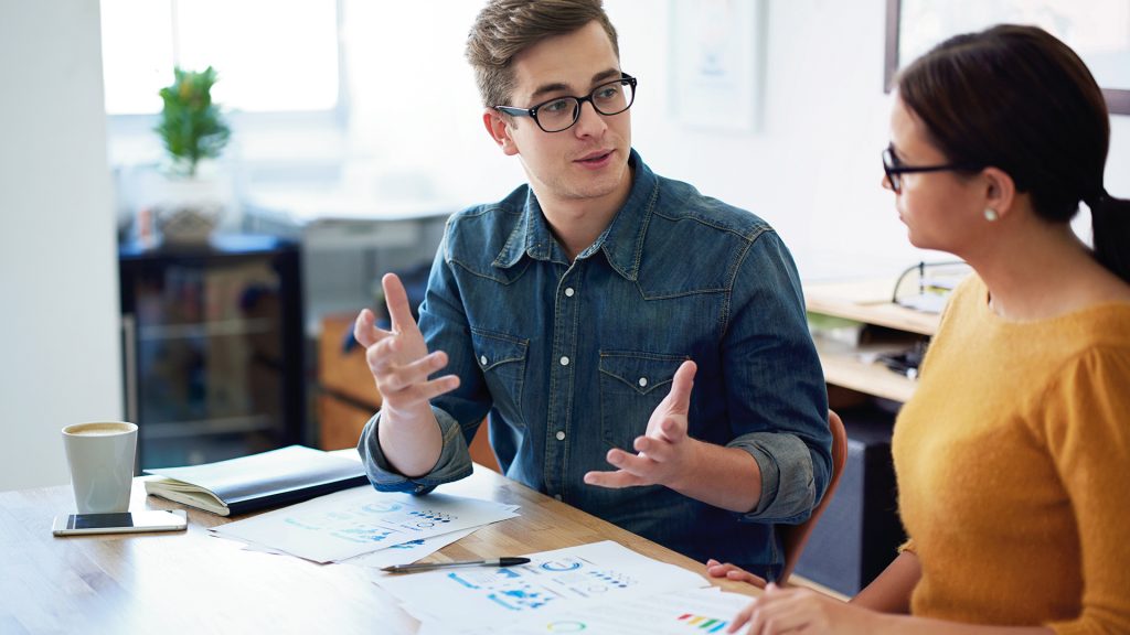 L male female both in glasses working table