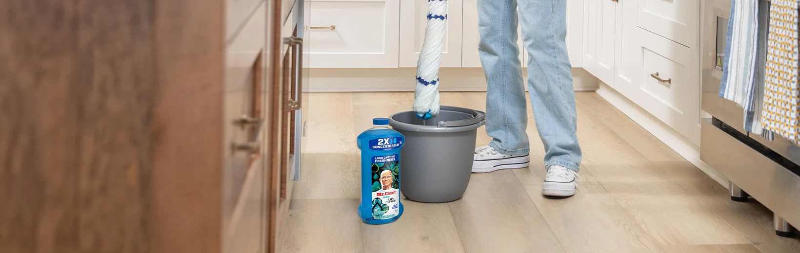 Cleaning laminate floors with a mop and Multi-Surface Cleaner Unstopables Fresh