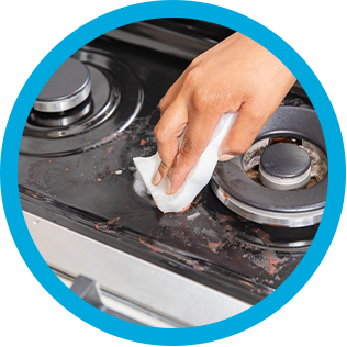 Cleaning a stovetop with Mr. Clean MagicEraser