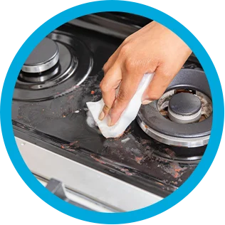 Cleaning a stovetop with Mr. Clean MagicEraser