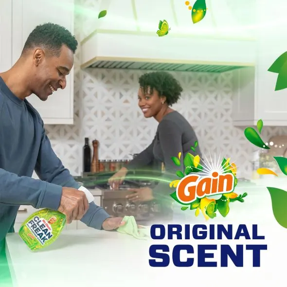 People cleaning a kitchen with a Mr. Clean CleanFreak Gain Scent