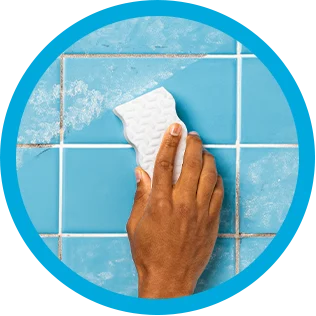 Cleaning bathroom tiles with Mr. Clean MagicEraser