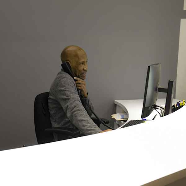 Employee helping a customer over the phone at Manhattan Mini Storage at 543 W 43rd St
