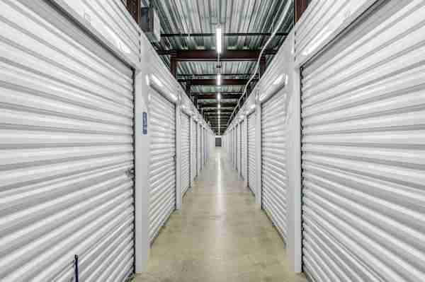 a well-lit row of self storage units at Manhattan Mini Storage in Randolph, NJ