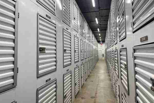 a well-lit row of closet size storage units at Manhattan Mini Storage in Chelsea