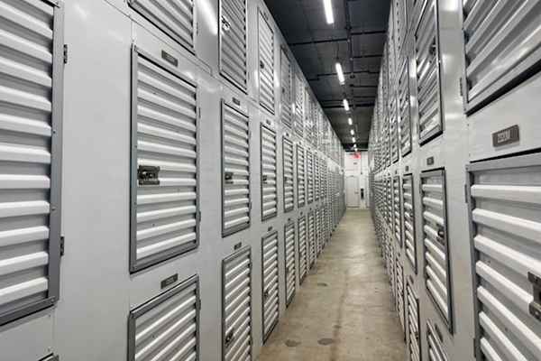 a well-lit row of closet size storage units at Manhattan Mini Storage in Chelsea