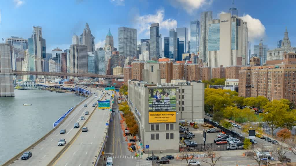 Manhattan Mini Storage on South Street from the a high up view with the New York city skyline in the background