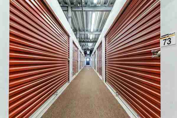 a row of well-lit self storage units in Secaucus at Manhattan Mini Storage